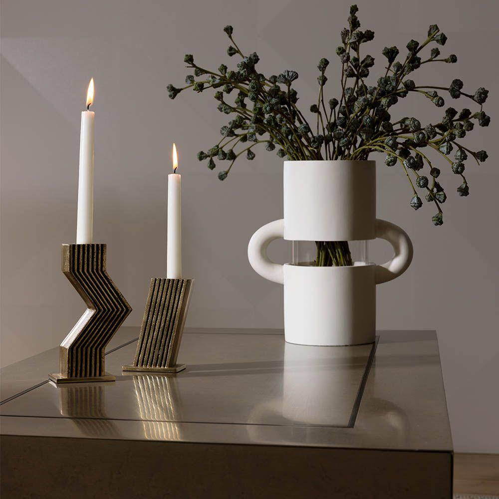 Geometric silhouette brass coloured candle holders