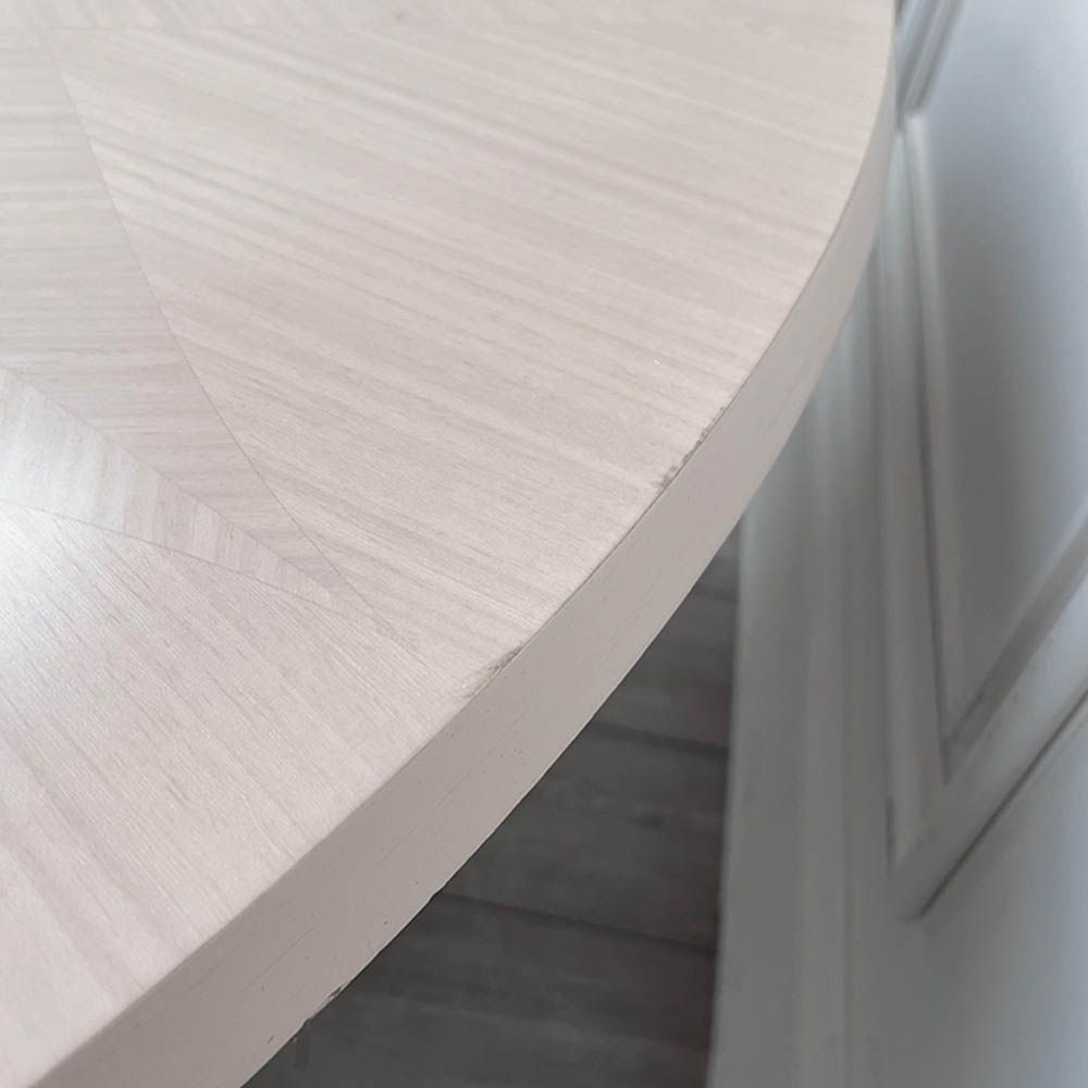 Round and decorative dining table with sculptural base