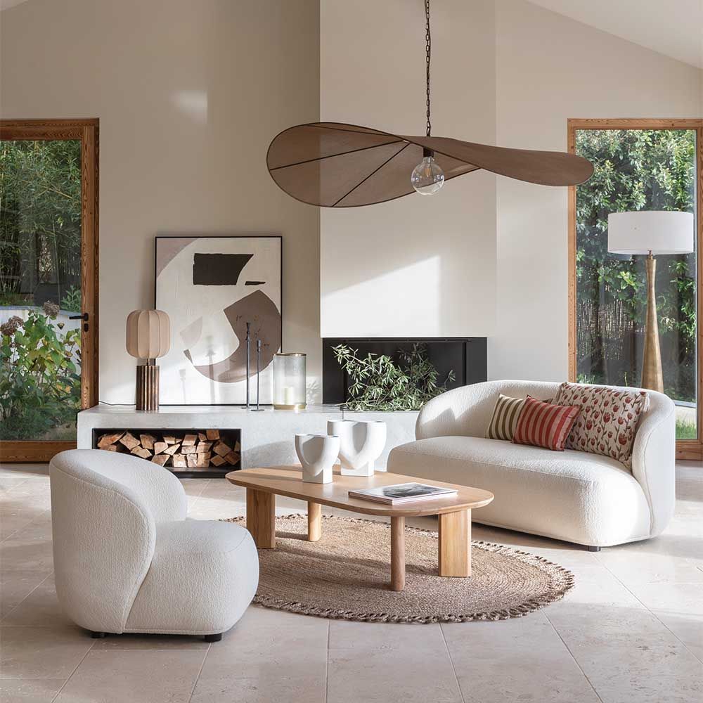 Elegant rounded boucle sofa with subtle wingback