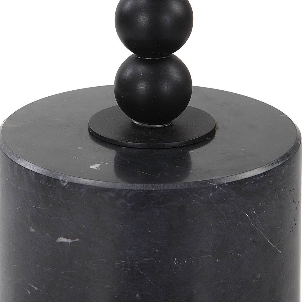 Circular black marble side table with delicate bead detailing