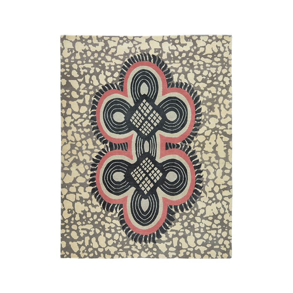 Striking patterned rug with red details and batik style