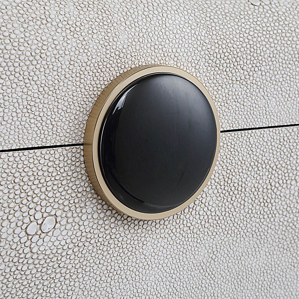 A stylish shagreen box with a white finish and black enamel closure