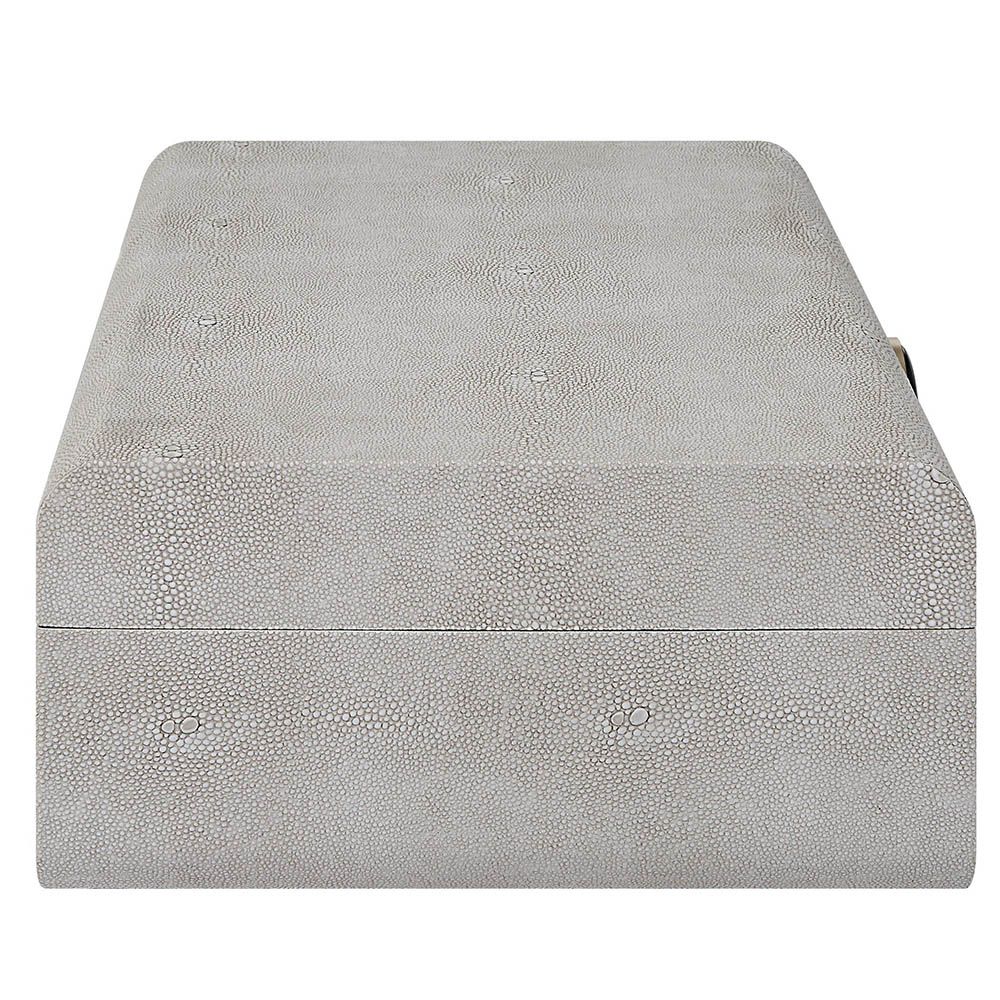 A stylish shagreen box with a white finish and black enamel closure