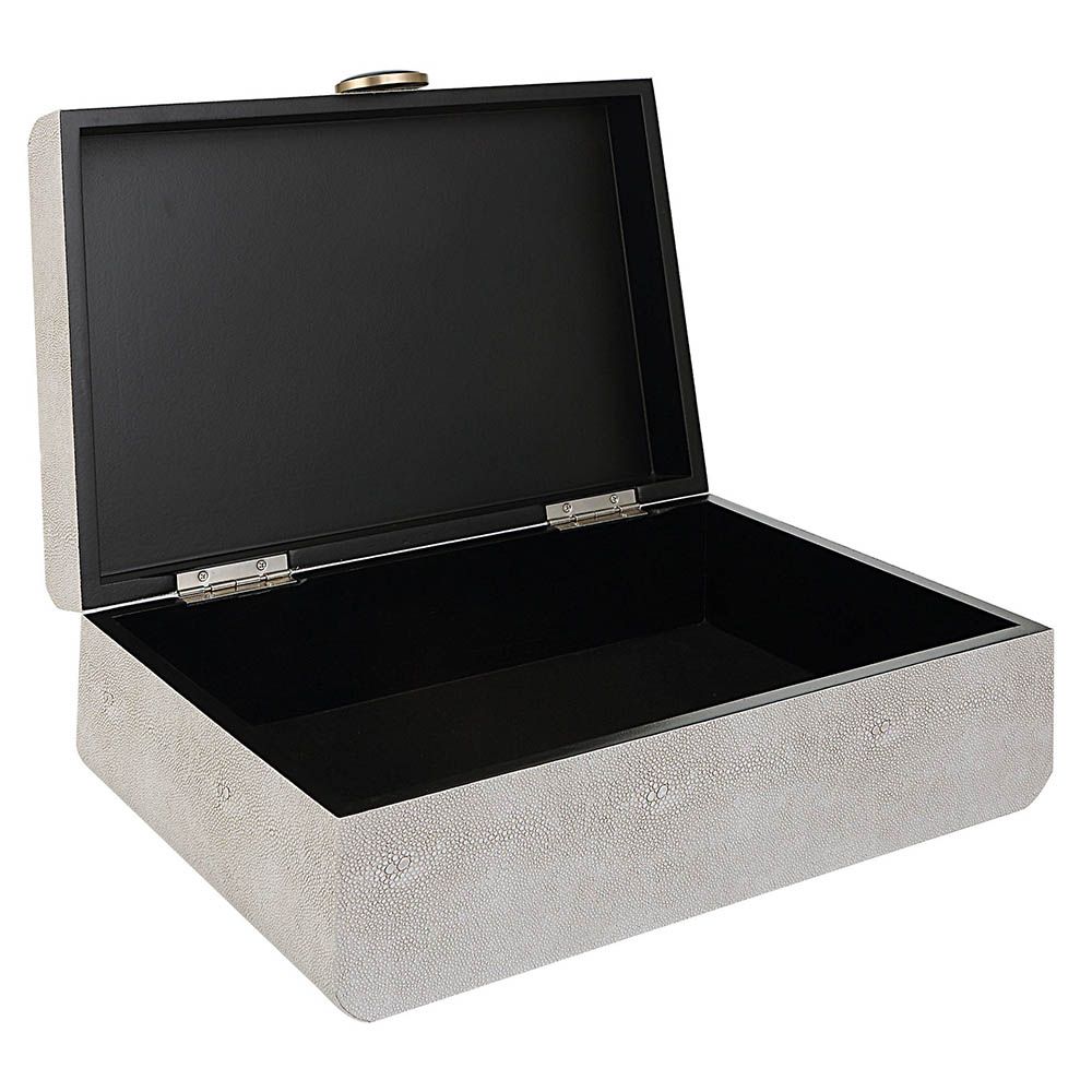 A stylish shagreen box with a white finish and black enamel closure
