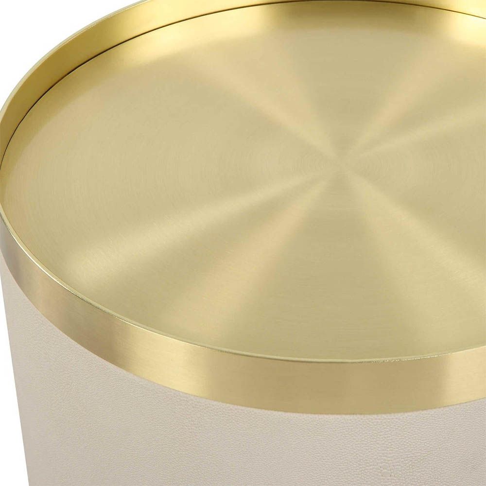 Luxurious round ivory accent table with brass top