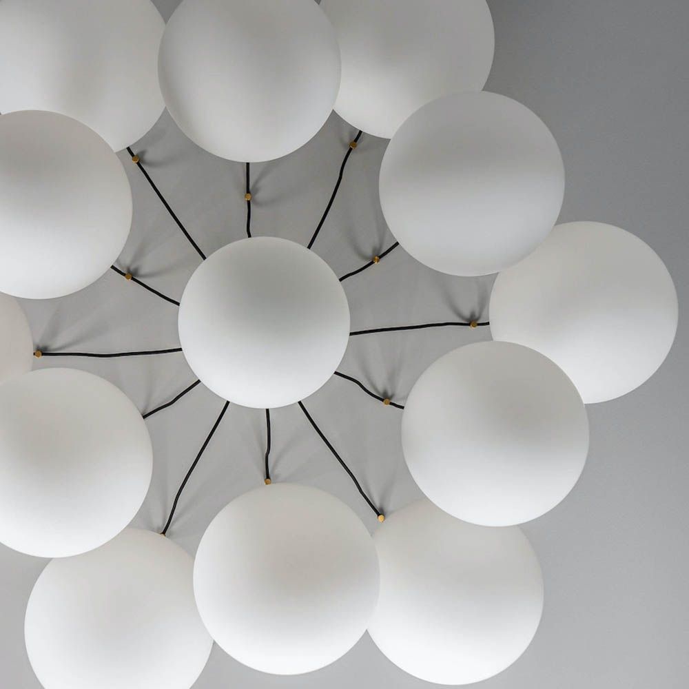 Striking chandelier with web-like suspension design and orb shades