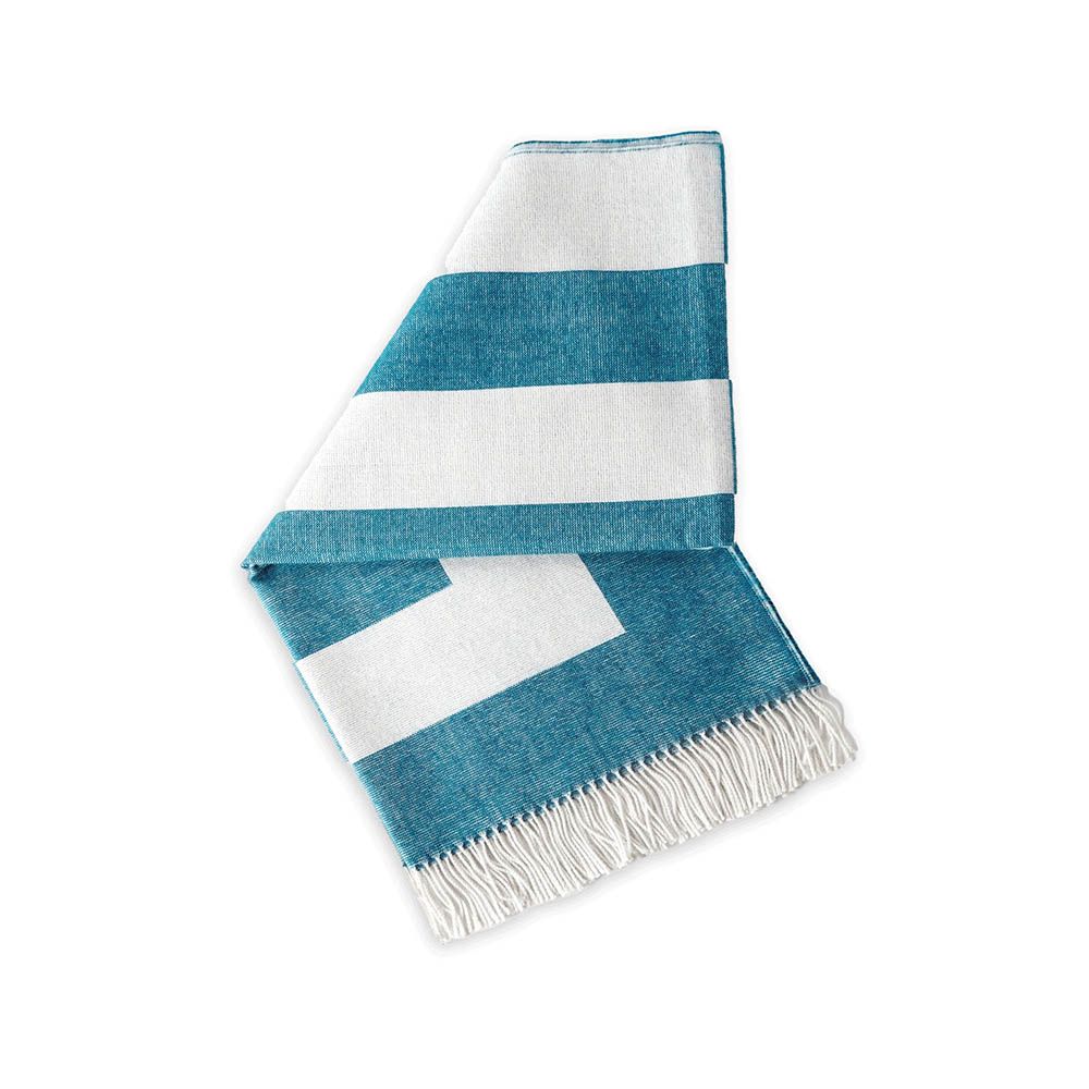Cozy graphic print throw in blue and white with fringe detail