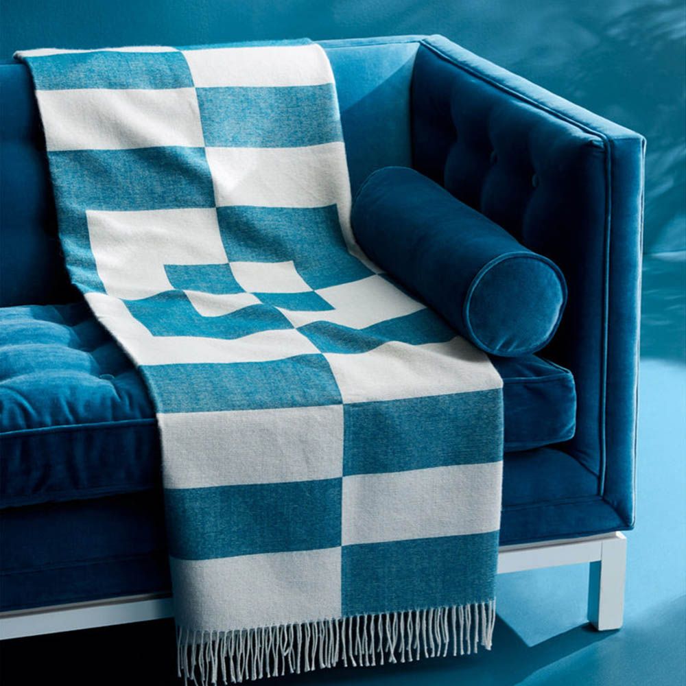 Cozy graphic print throw in blue and white with fringe detail