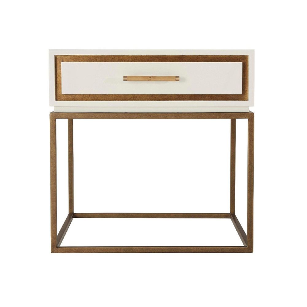 A stylish side table with a white high gloss varnish, a bamboo handle and finished with gold details