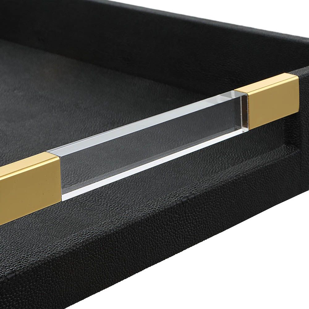 Sleek black shagreen textured tray with clear acrylic handles and brass accents