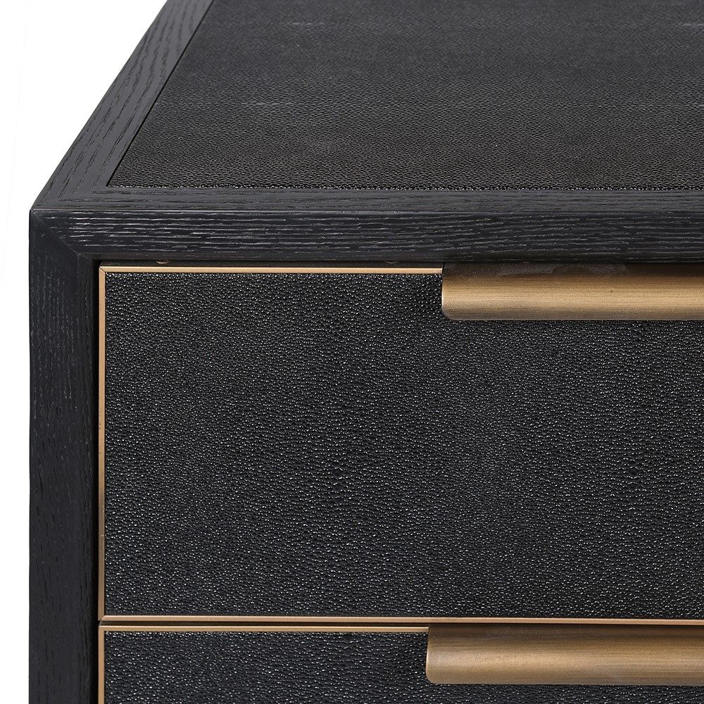 Black chest of drawers with gold detailing