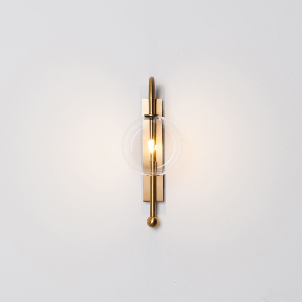 Natural solid brass industrial wall lamp with large handblown glass globe