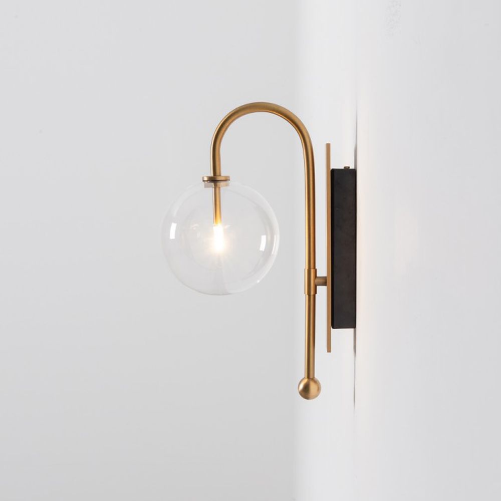 Natural solid brass industrial wall lamp with large handblown glass globe