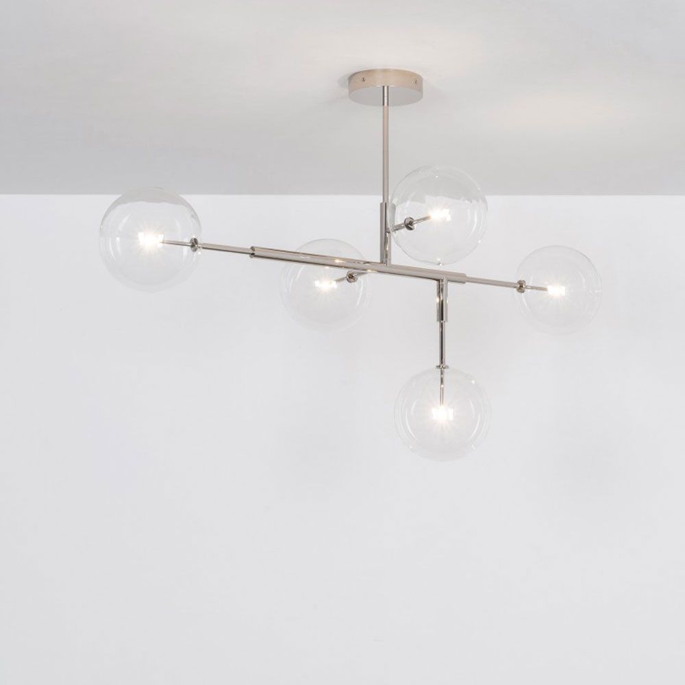 A dazzling polished nickel LED pendant with transparent glass lampshades