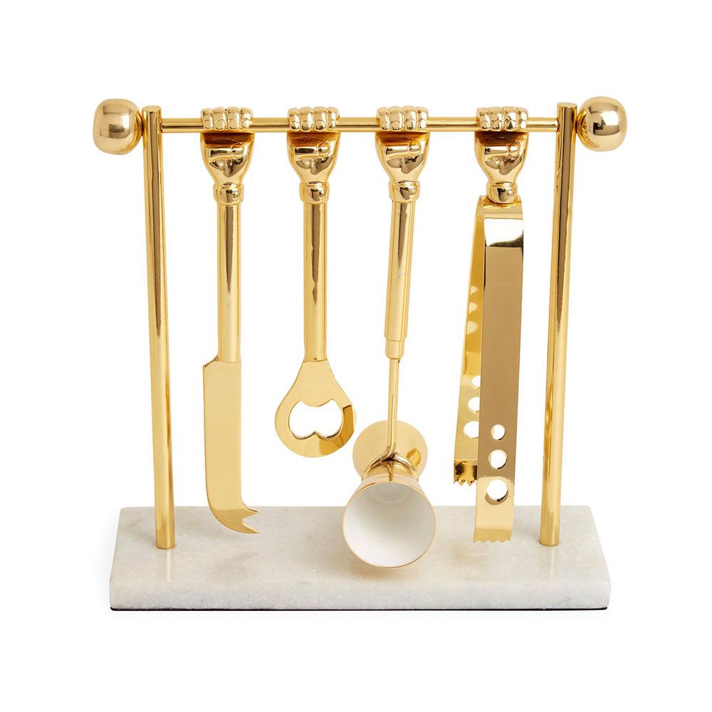 a luxurious solid brass barware set featuring ice tongs, bottle opener, double jigger, and knife