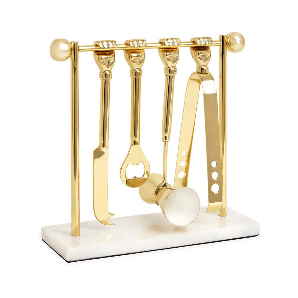 a luxurious solid brass barware set featuring ice tongs, bottle opener, double jigger, and knife
