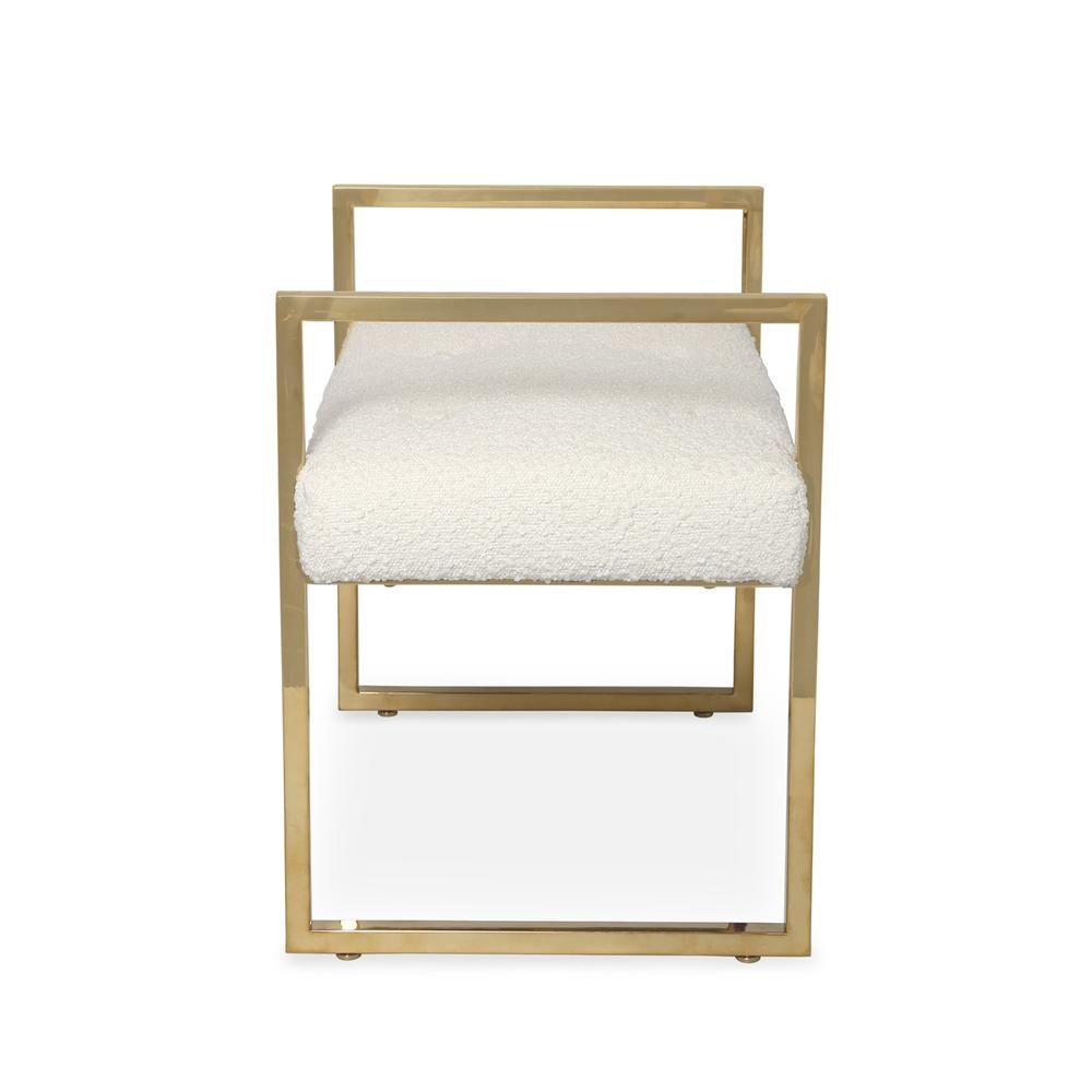A chic boucle bench with a stylish brass frame
