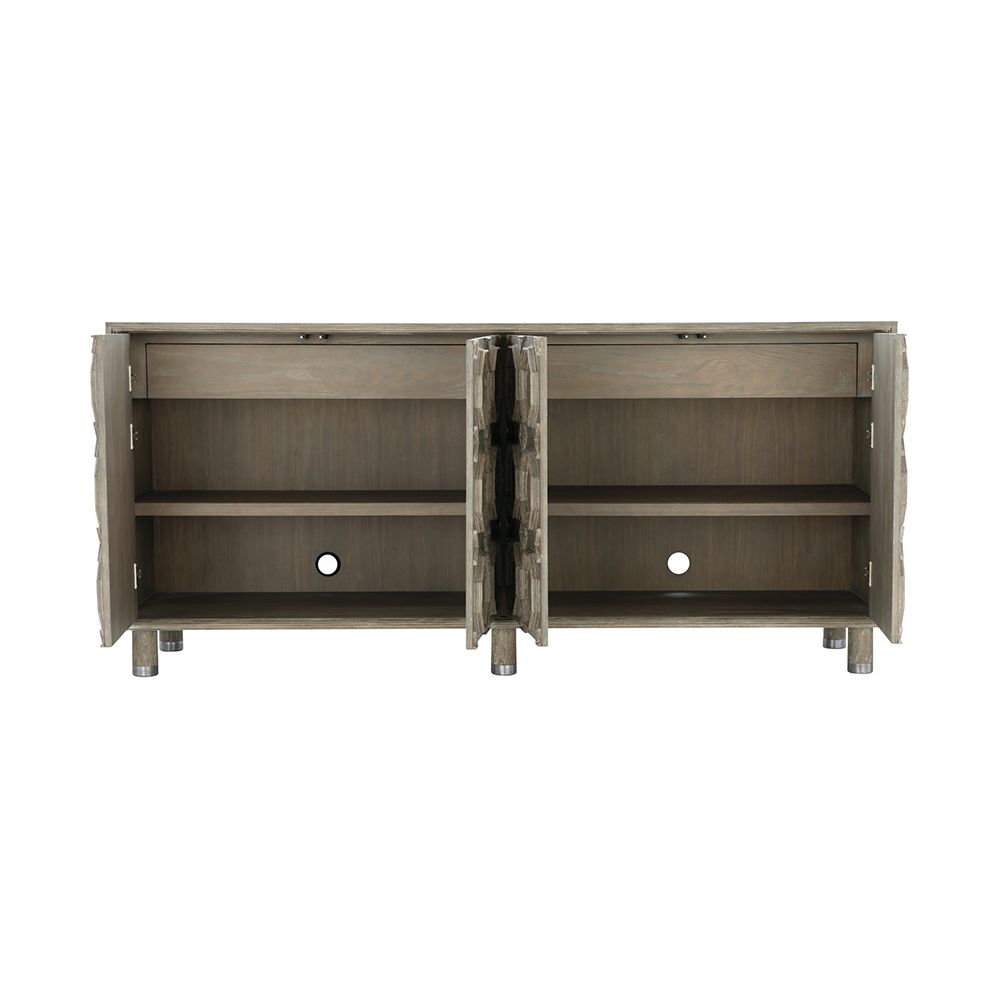 A textured wooden sideboard with four carved geometric patterned doors and finished with nickel plated aluminium legs