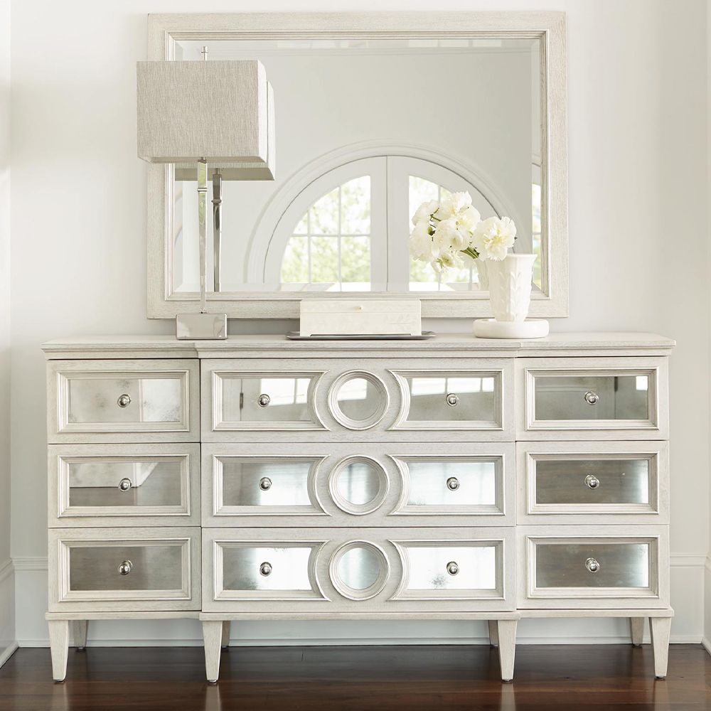 A contemporary rectangular mirror featuring a natural wood frame with a bevelled edge and a white finish