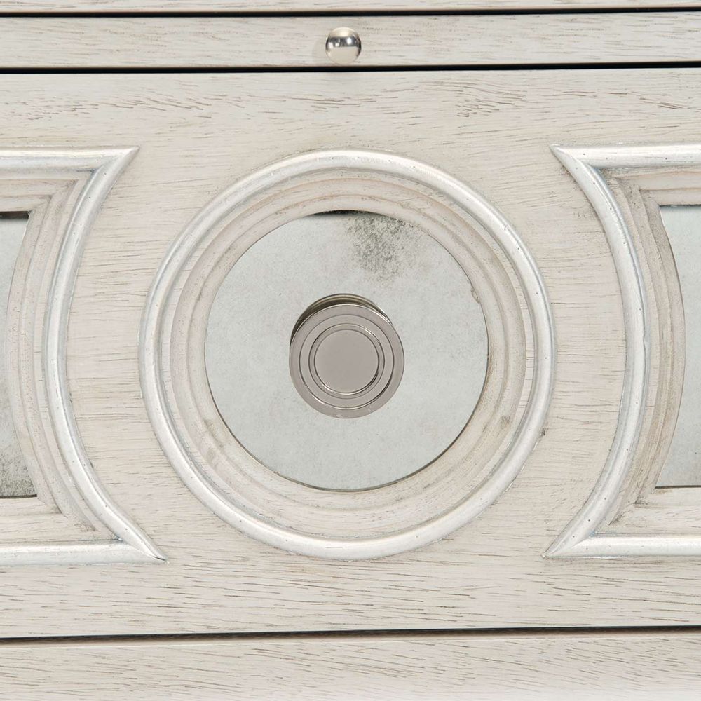 An elegant white oak veneer bedside table with two antiqued mirrored glass panel drawers, Silver Luster highlights and a Manor White finish