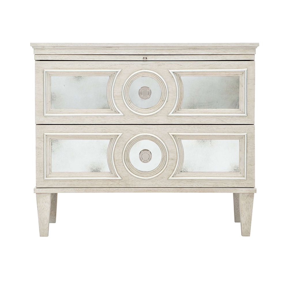 An elegant white oak veneer bedside table with two antiqued mirrored glass panel drawers, Silver Luster highlights and a Manor White finish