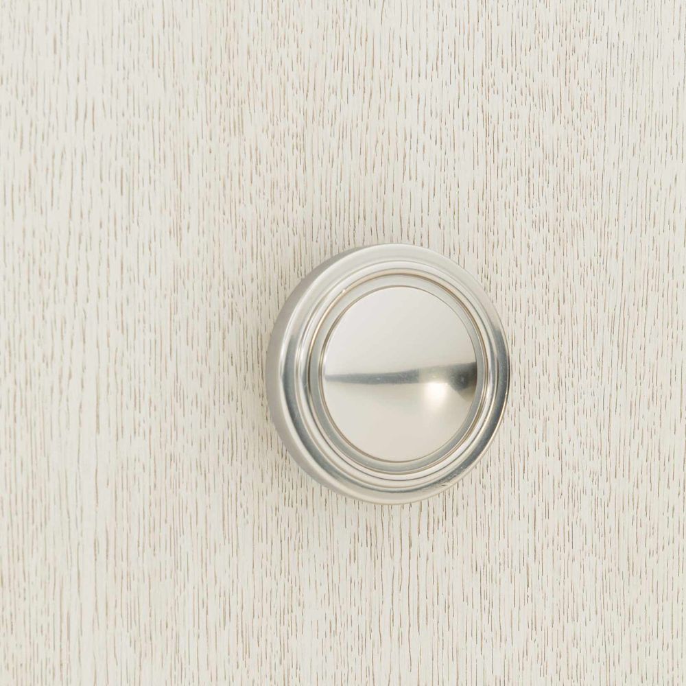 A chic natural wood tv and entertainment unit with 4 doors and metal fixtures