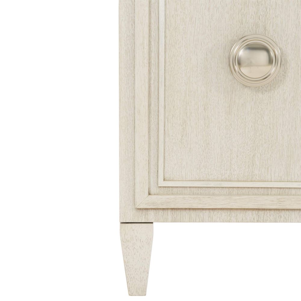 A chic natural wood tv and entertainment unit with 4 doors and metal fixtures