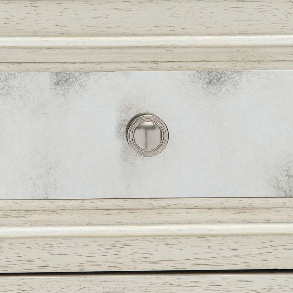 A luxury white oak veneer chest of drawers accentuated by antiqued mirrored glass panels with Silver Luster highlights and a Manor White finish