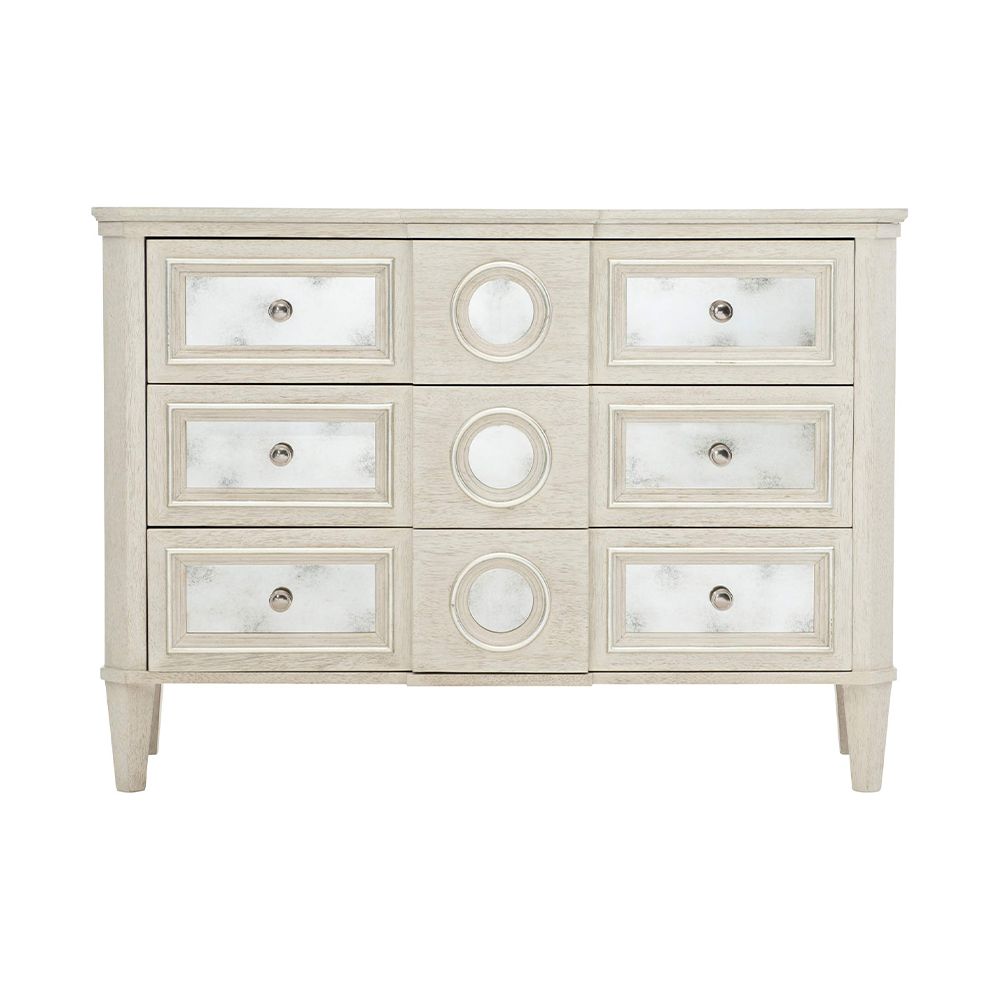 A luxury white oak veneer chest of drawers accentuated by antiqued mirrored glass panels with Silver Luster highlights and a Manor White finish