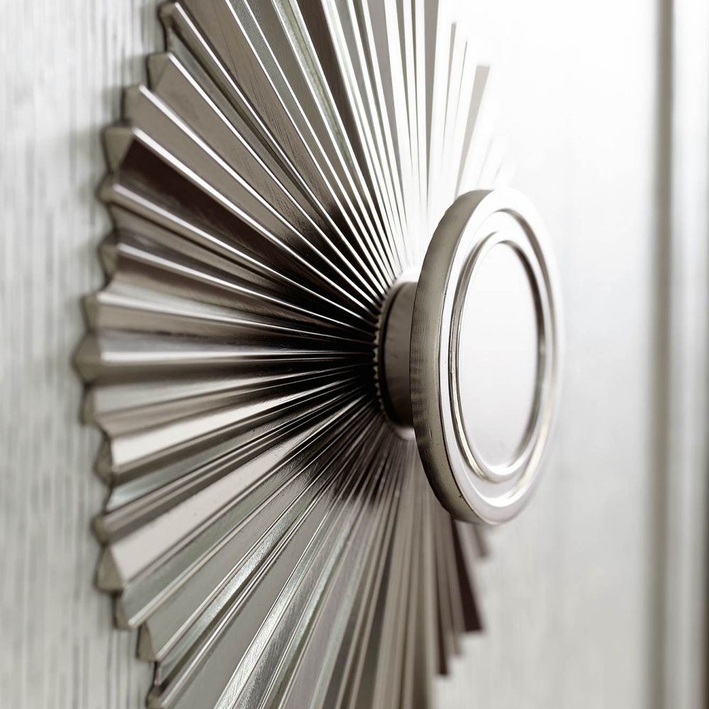 An exquisite sideboard with an elegant white finish, stunning silver highlights and floral inspired features