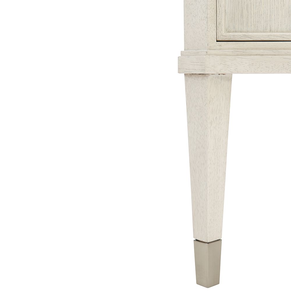 An exquisite sideboard with an elegant white finish, stunning silver highlights and floral inspired features