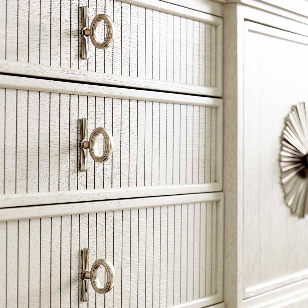 An exquisite sideboard with an elegant white finish, stunning silver highlights and floral inspired features