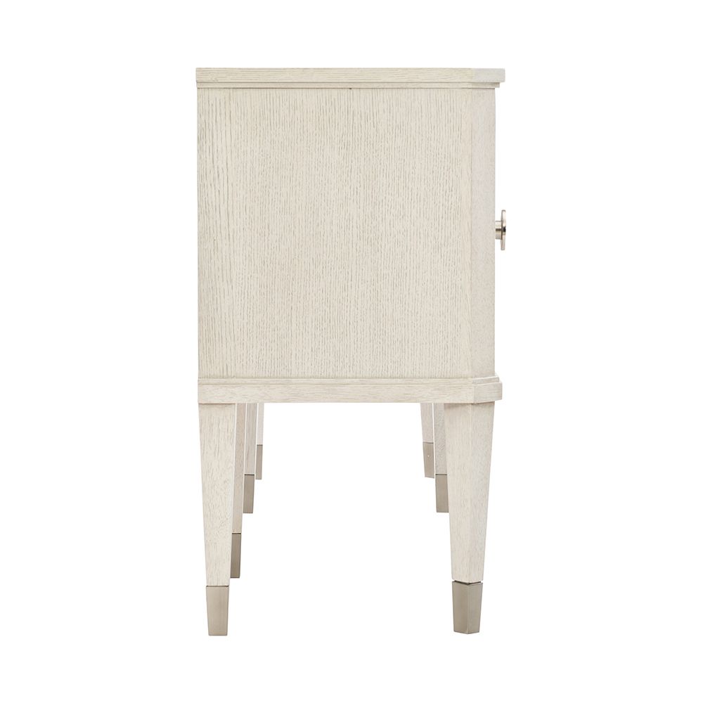 An exquisite sideboard with an elegant white finish, stunning silver highlights and floral inspired features