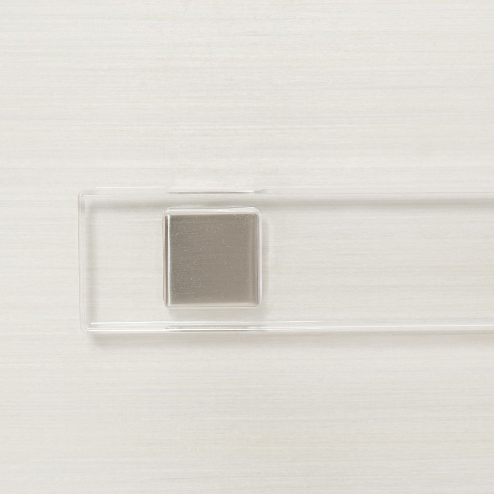 A sophisticated bedside table by Bernhardt featuring a grey and white finish and completed with three spacious drawers