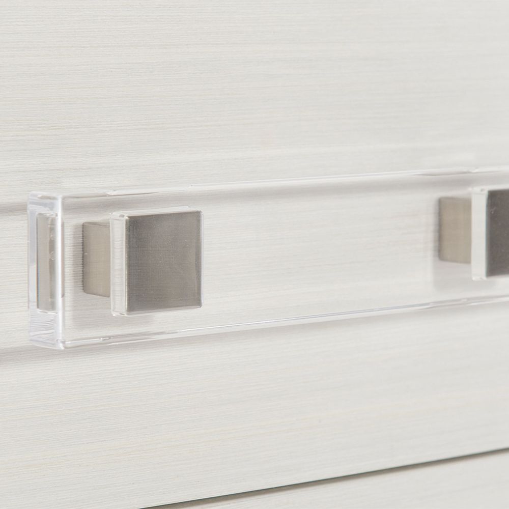 A sophisticated bedside table by Bernhardt featuring a grey and white finish and completed with three spacious drawers