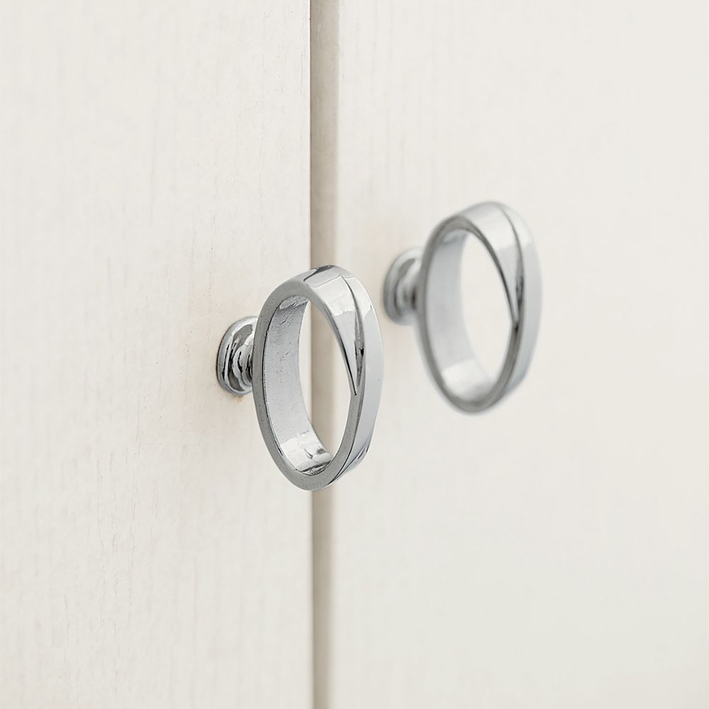 A contemporary entertainment unit with polished stainless steel accents, four drawers, two doors and internal shelving