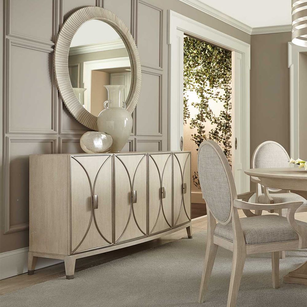 A stylish buffet with four curved silver metal framed overlaid doors and ample internal storage 
