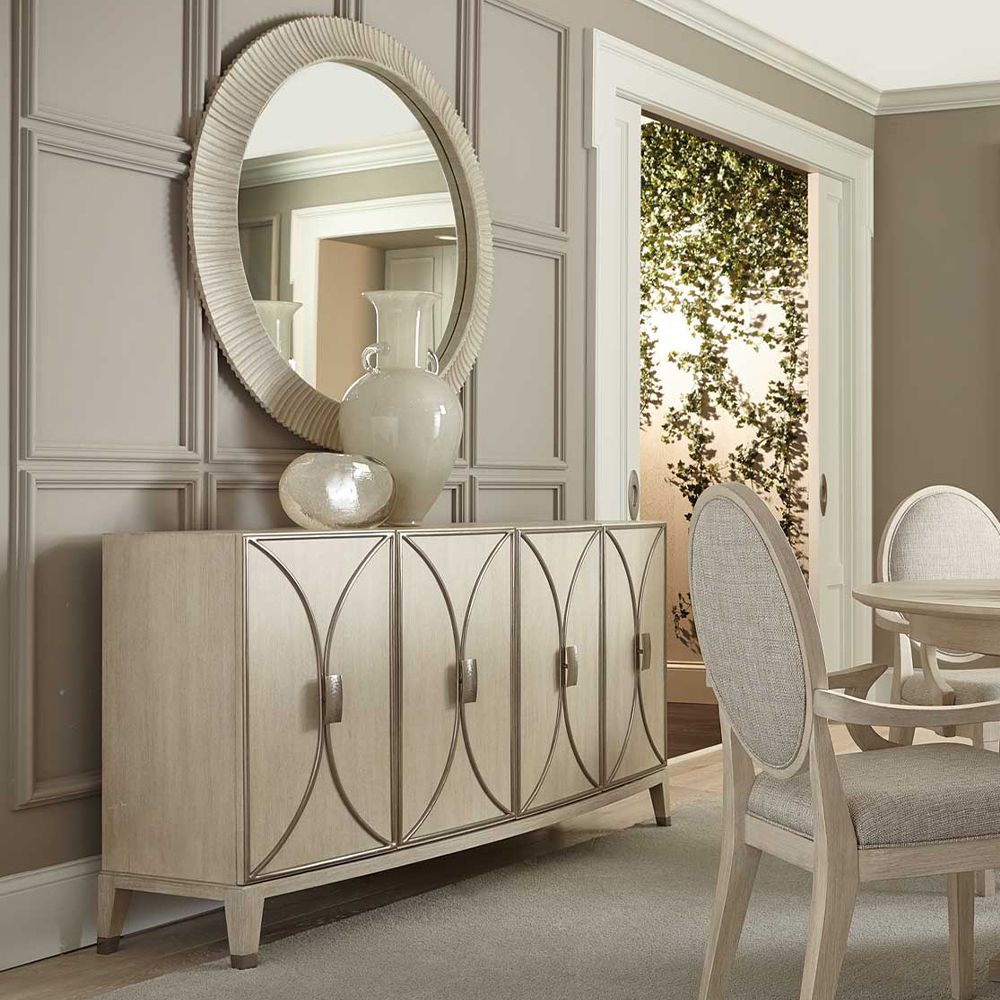 A contemporary round mirror by Bernhardt with a coastal style wooden frame 
