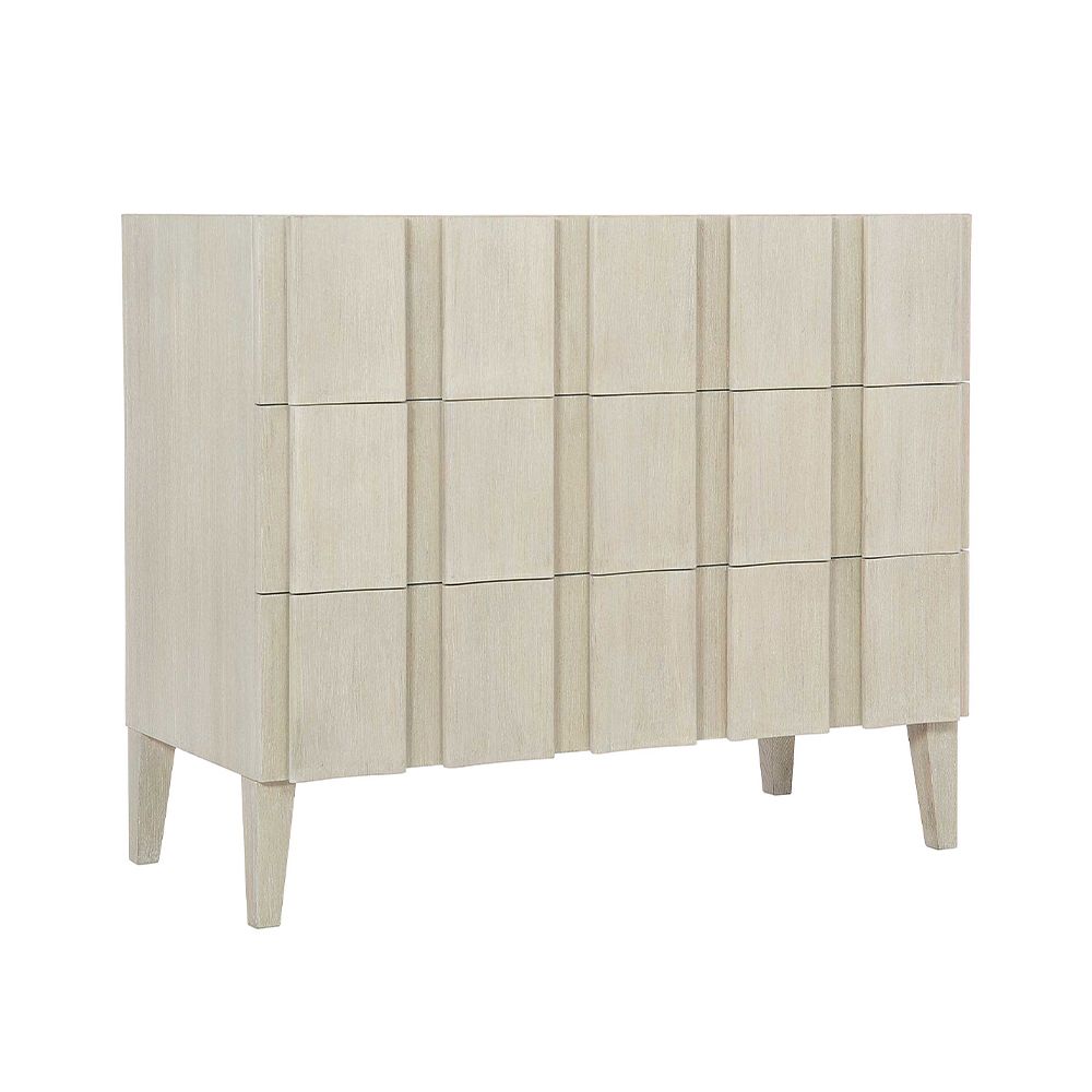 A unique three drawer chest by Bernhardt with shaped vertical overlays and a beautiful natural aged wood finish