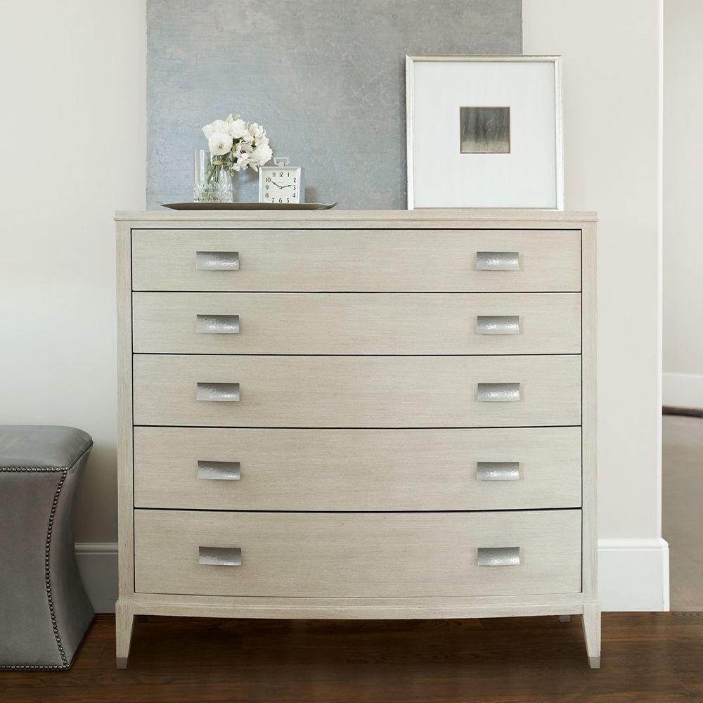 A beautiful chest of drawers from Bernhardt with five drawers and tarnished nickel handles 