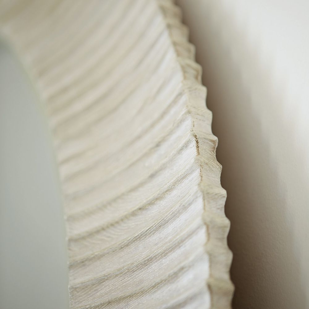 A contemporary round mirror by Bernhardt with a coastal style wooden frame 