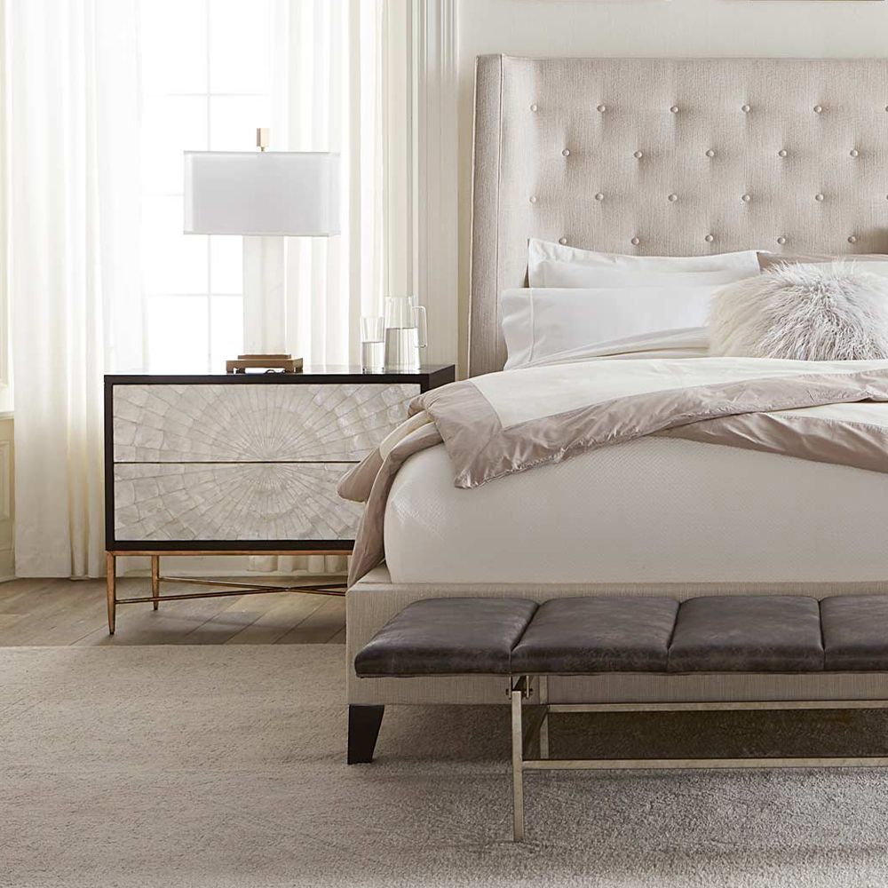 An expresso coloured bedside table with two iridescent Capiz shell drawers and a solid-steel base with a beautiful bronze finish