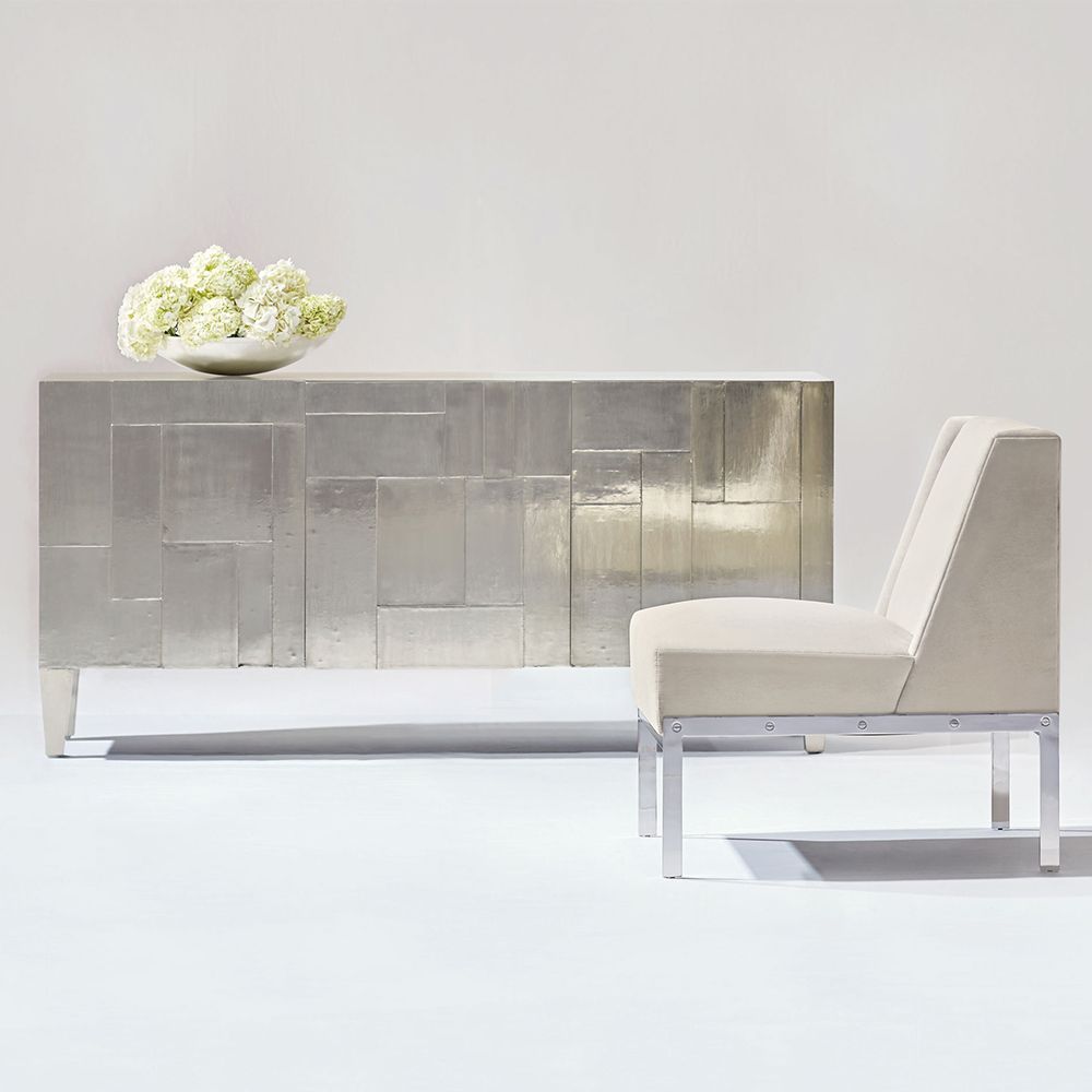 A decorative three door entertainment unit with a unique design, silver finish and internal storage