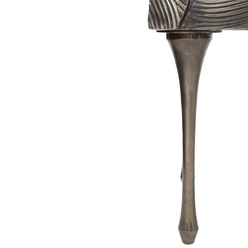 A textured statement sideboard with four unique doors, six sleek metal legs and an abundance of internal storage 