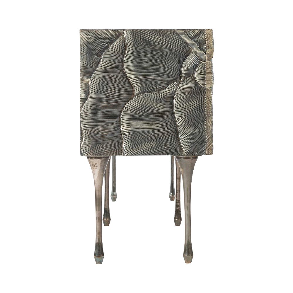 A textured statement sideboard with four unique doors, six sleek metal legs and an abundance of internal storage 