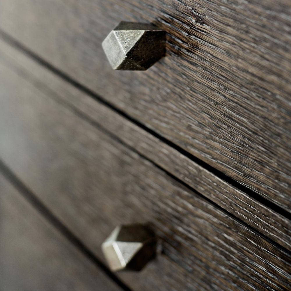 A rich, charcoal 8-drawer dresser with tarnished nickel hardware