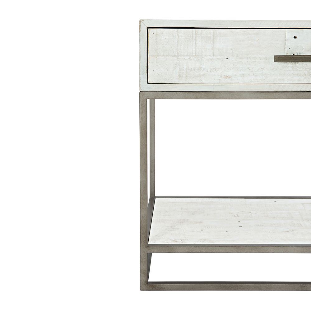 A contemporary, rustic one-drawer bedside table finished in a white wood with a glazed silver finish and featuring a planked bottom shelf