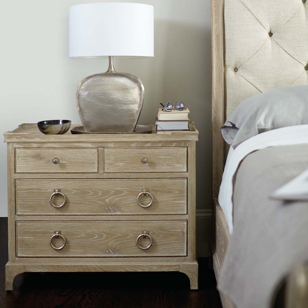 A 4 drawer bedside table in a sand finish