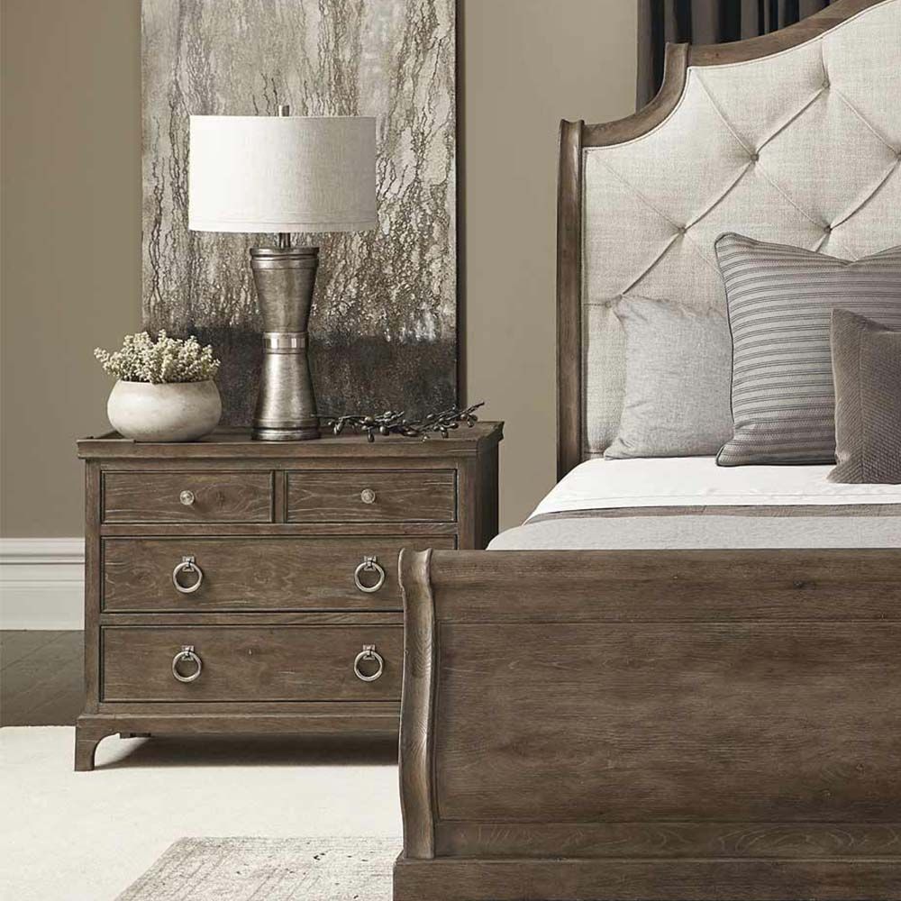 A dark featured bedside table with four drawers