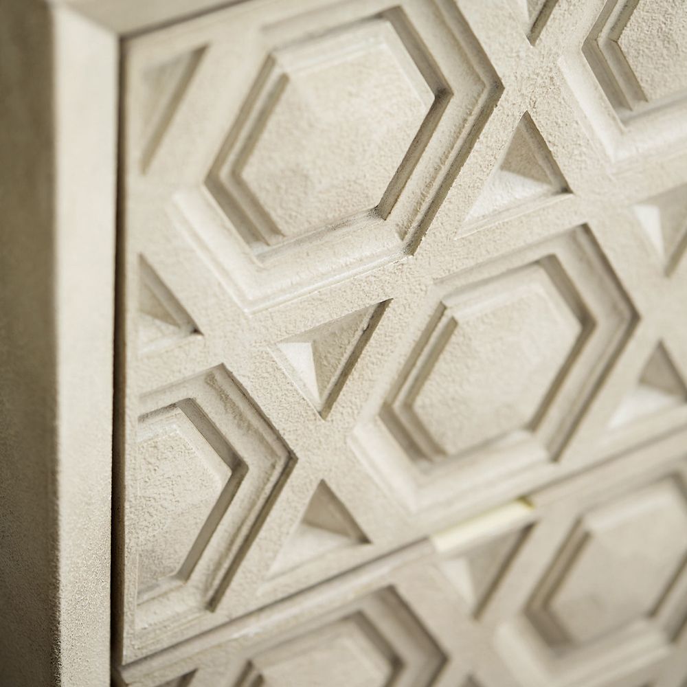 A unique two drawer chest of drawers from Bernhardt with a textured geometric design and stainless steel base with a nickel finish 